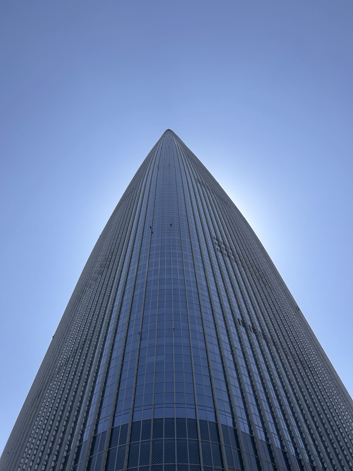 Glass office tower rising against the sky
